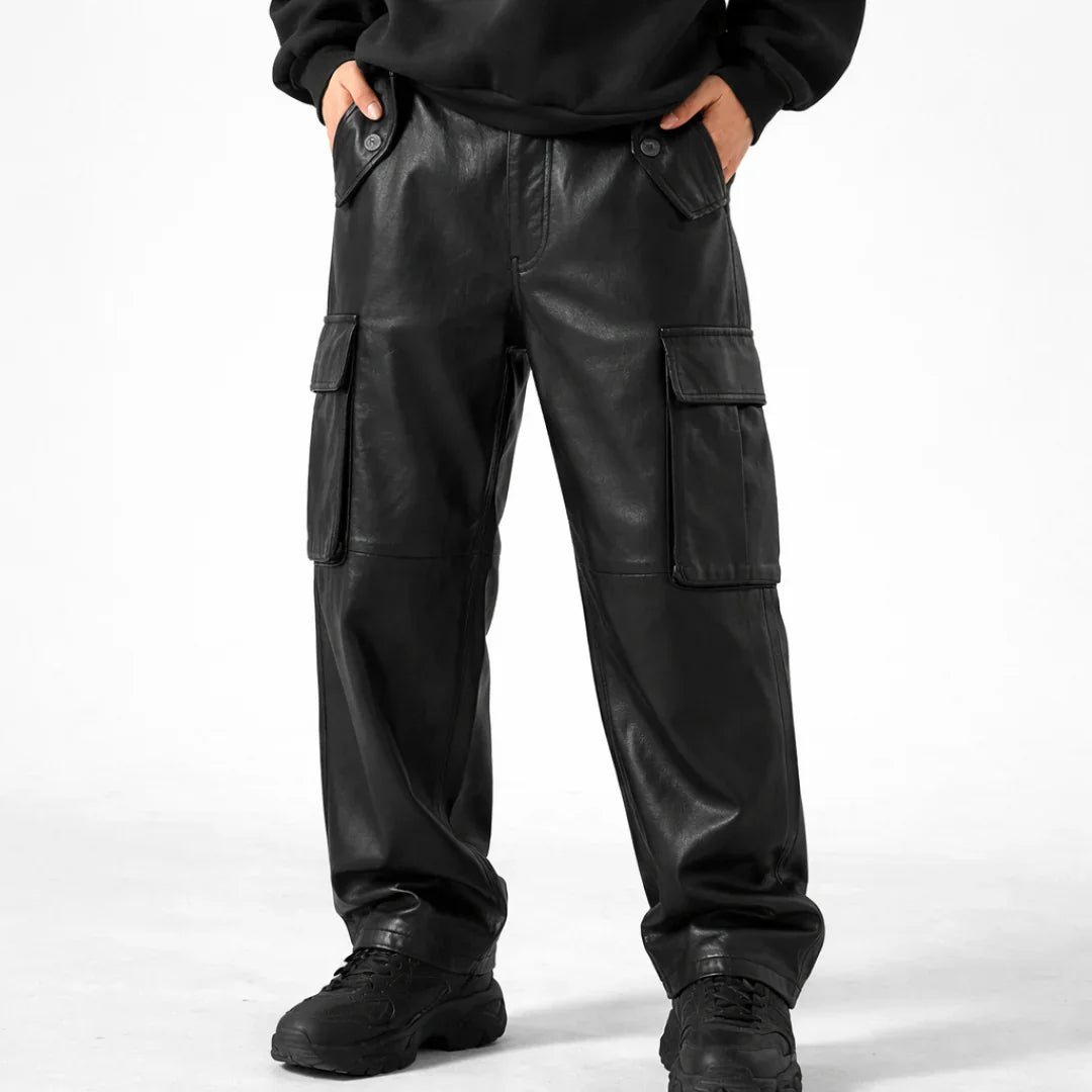 Black leather cargo pants with side pockets, styled with a black hoodie and boots