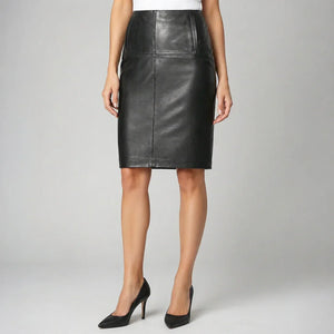 Woman wearing a knee-length black leather skirt with a fitted design and high heels.