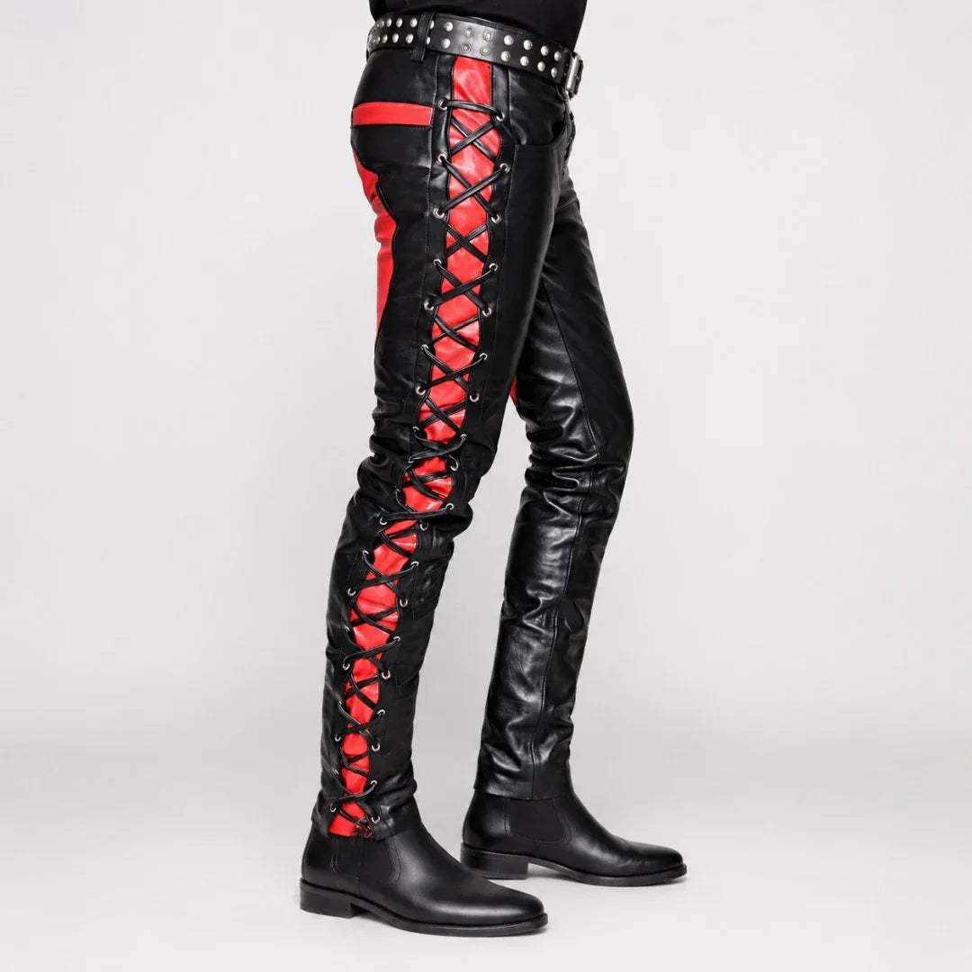 Black leather pants with red lace-up sides and studded belt, paired with black boots