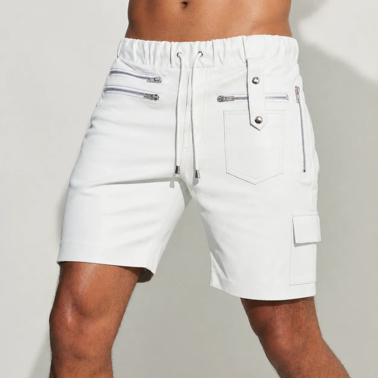 Men's white genuine leather shorts with front zip pockets, drawstring waist, and cargo pocket