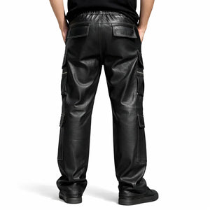 Back view of black lambskin leather cargo pants with multiple pockets, worn by a male model.