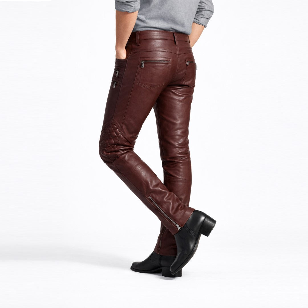Men's brown genuine leather pants with zippered pockets and panel detailing, back view