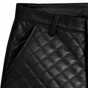 Close-up of men's black genuine leather pants with slim fit and quilted biker design
