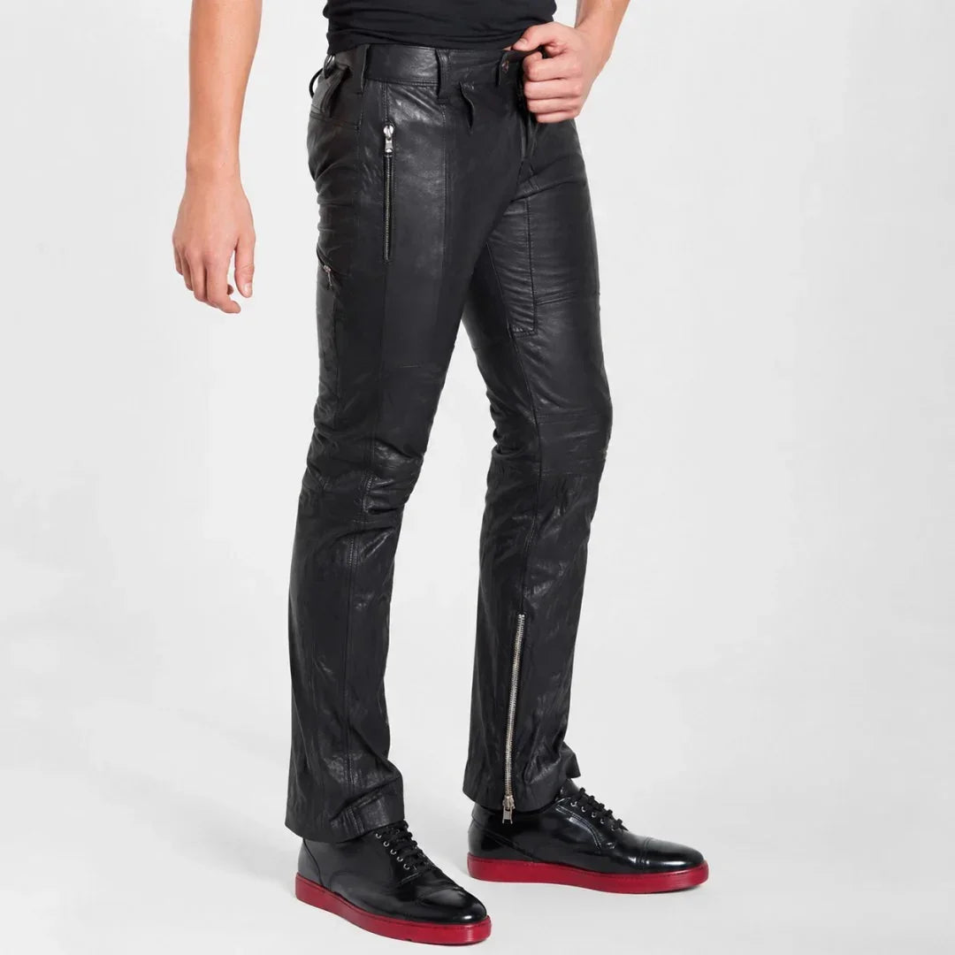 Black leather pants with side zippers, styled with black shoes and red soles for men
